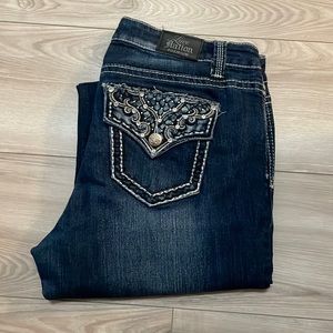 Love nation dark wash jeans. Super cute design on back.